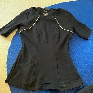 Super fun jaanuu women’s small scrub top. Strong stretchy texture